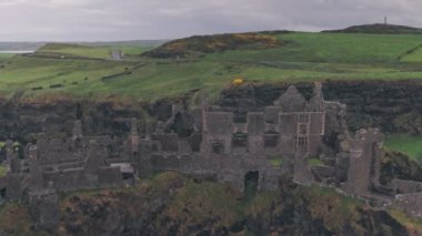 Dunluce Castle ruins on the Antrim Coast, Northern Ireland. Aerial drone view