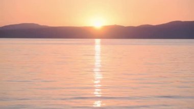 Landscape sunset view reflected on Lake Bracciano, Italy