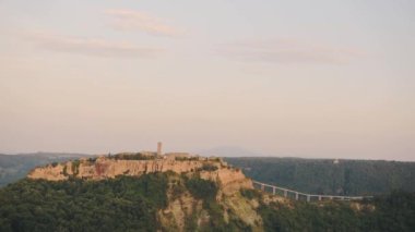 The Only Footbridge Of The Small Town Of Civita di Bagnoregio On The Top Of The Plateau Of Volcanic Tuff In Viterbo, Italy. -wide shot