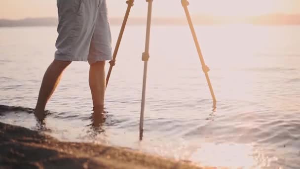 Young Man Leg Standing Shoreline While Taking Video Sunset Lake — Stockvideo