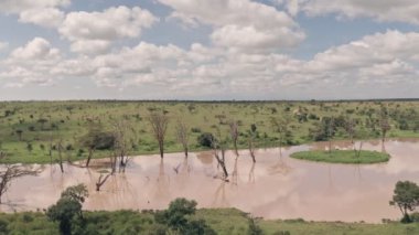 Waterhole lake in Laikipia, Kenya. High flying aerial drone view of beautiful Kenyan landscape