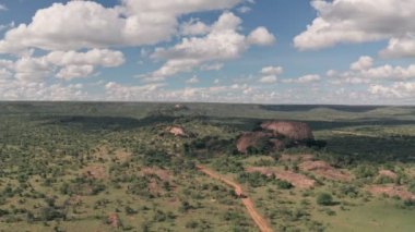 4 wheel drive on safari at Baboon Rock in Laikipia, Kenya. High aerial drone view
