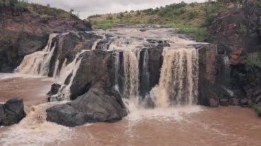 Waterfall in river in Laikipia, Kenya. Static aerial drone view