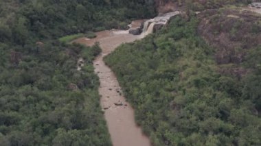 Waterfall in river in Laikipia, Kenya. High aerial drone view of Kenyan landscape