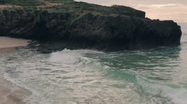Slow motion drone view of waves crashing on beach at Watamu near Malindi in Kenya. Aerial drone view