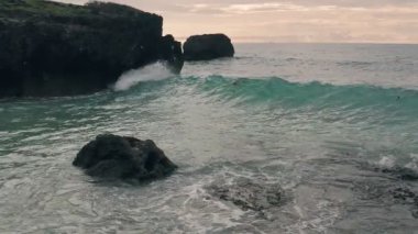 Slow motion drone view of waves crashing on rocks at Watamu near Malindi in Kenya. Aerial drone view