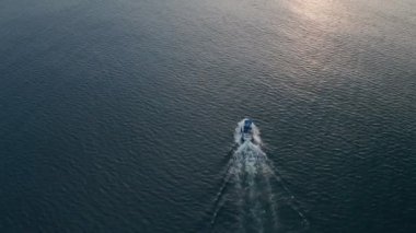 Deep sea fishing boat at sunrise in the Indian Ocean at Watamu, Malindi, Kenya. Aerial drone view
