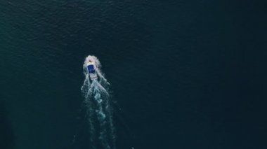 Deep sea fishing boat trip at sunrise in the Indian Ocean at Watamu, Malindi, Kenya. Top down aerial drone view