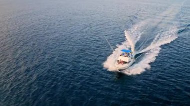 Deep sea fishing boat at sunrise in the Indian Ocean at Watamu, Malindi, Kenya. Aerial drone view