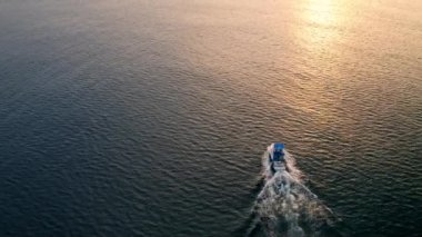 Deep sea fishing boat at sunrise in the Indian Ocean at Watamu, Malindi, Kenya. Aerial drone view
