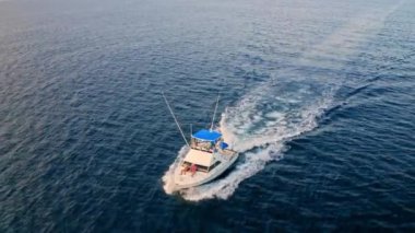 Deep sea fishing boat at sunrise in the Indian Ocean at Watamu, Malindi, Kenya. Aerial drone view