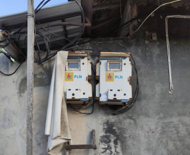 Bali, Indonesia - June 22, 2022: two PLN (Indonesian Goverment Electricity Company) electricity boxes
