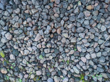 Üst görünüm çakıl dokusu. Küçük yol taşı arka planı. Koyu çakıl taşları, taş dokusu pürüzsüz..