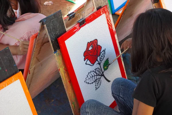 children draw at the festival fair. train children's creativity.