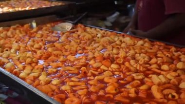Bali, Indonesia - July 10, 2022: Tteokbokki, this is a common street food found in South Korea. Korean Street Food