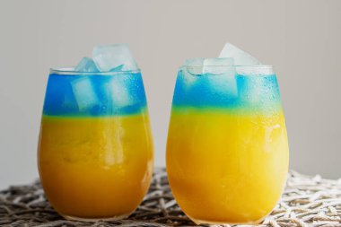 Blue and yellow cocktails like the flag of Ukraine. Two patriotic cocktails, victory concept. Close up