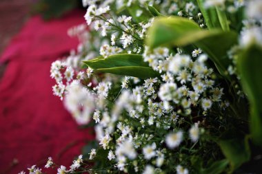 Groom and Bride-traditional ceremony-flower bouquet in a traditional wedding in West Java-Indonesia.
