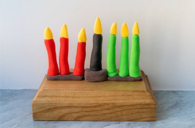 Kinara. Traditional Kwanzaa symbols. African American holiday. Hand-sculpted kinara from plasticine