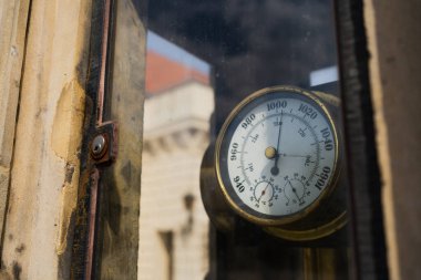 Old barometer on urban street in Wroclaw clipart
