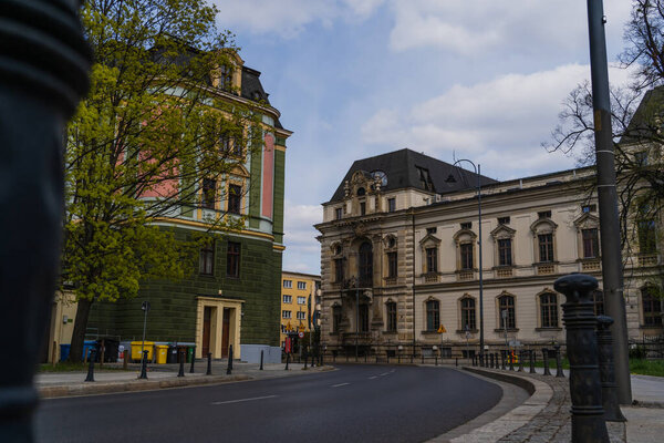 Empty urban street with old buildings and road in Wroclaw