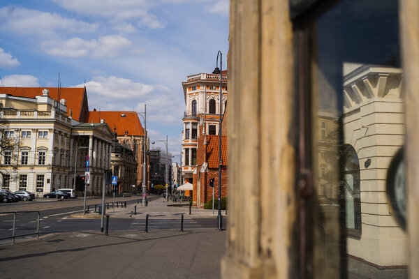 Buildings and crosswalk on urban street in Wroclaw