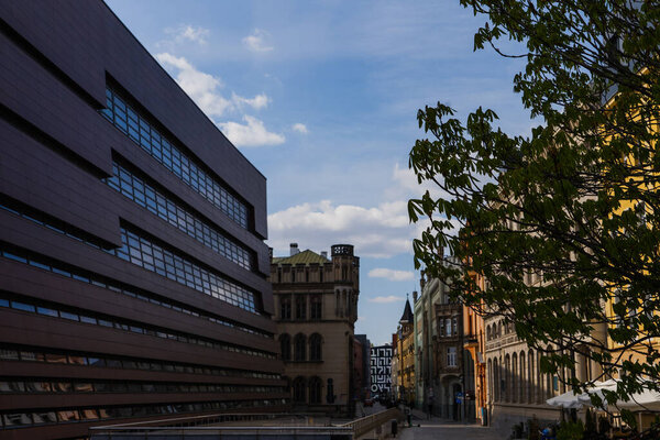 Buildings on street at daytime in Wroclaw