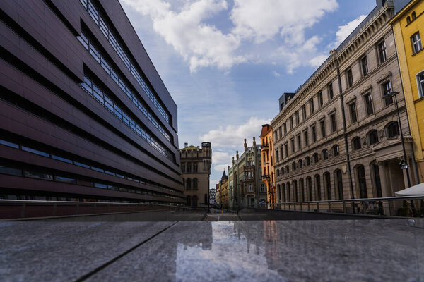 Modern and old buildings on urban street in Poland 