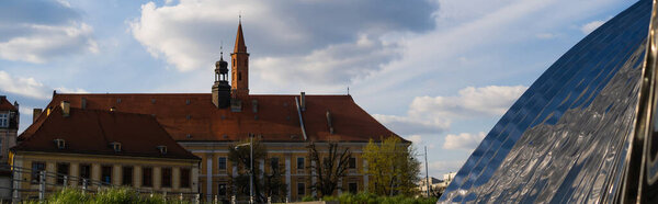 View of Nawa arch on urban street in Wroclaw, banner 