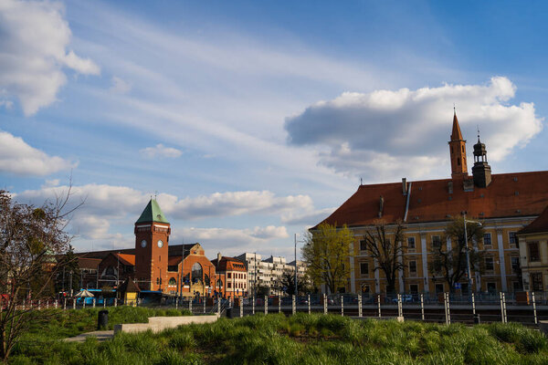Old buildings and Market Hall on urban street in Poland 
