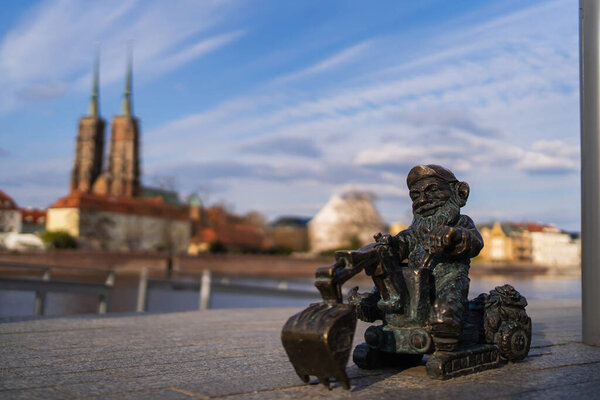 WROCLAW, POLAND - APRIL 18, 2022: Bronze gnome on urban street 