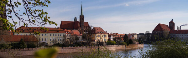 Old buildings on embankment of Ostrow Tumski in Wroclaw, banner 