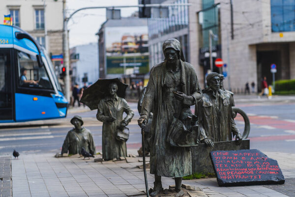 WROCLAW, POLAND - APRIL 18, 2022: Anonymous Pedestrians memorial and signboard on urban street 