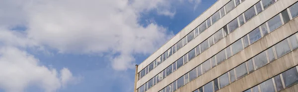 Low angle view of building and cloudy sky in Wroclaw, banner — Stock Photo