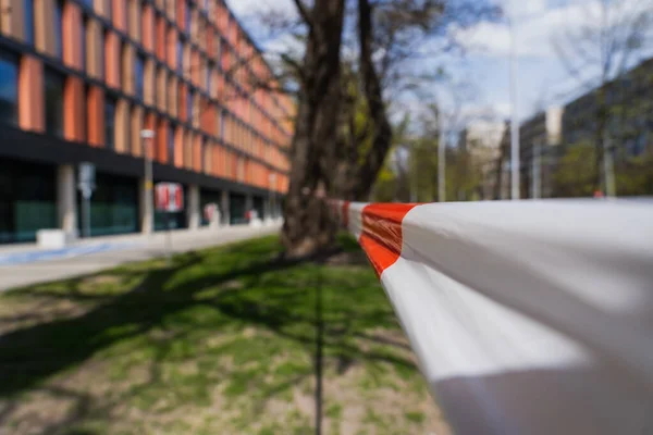 Barrier tape on blurred urban street in Wroclaw — Stock Photo