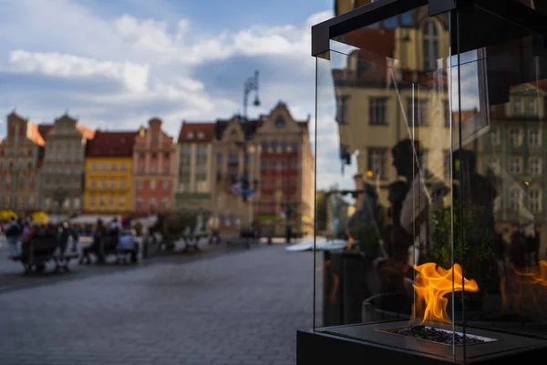 Fire in glass box on urban street in Wroclaw — Stock Photo