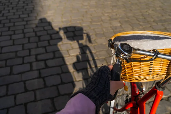 Cropped view of woman cycling on urban street in Wroclaw — Stock Photo