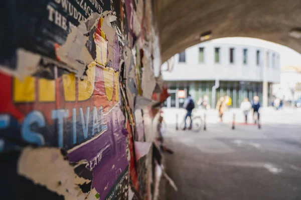 WROCLAW, POLAND - APRIL 18, 2022: Advertising on wall in arch on urban street — Stock Photo