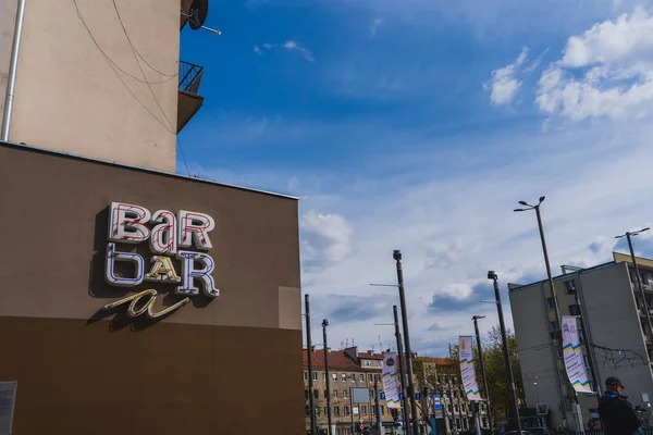 WROCLAW, POLAND - APRIL 18, 2022: Signboard on facade of building on urban street — Stock Photo