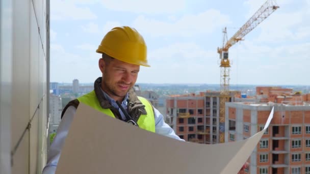 Close Caucasian Handsome Young Professional Male Constructor Helmet Looking Plan — Stock video