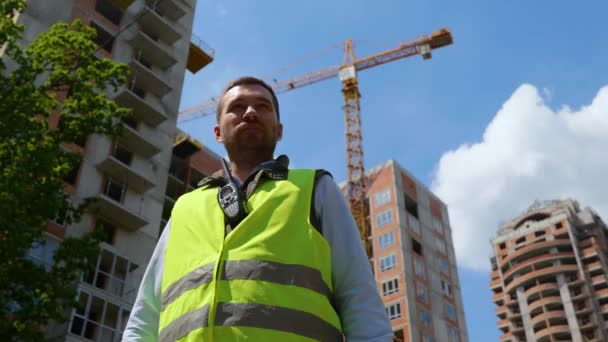Bottom View Joyful Young Caucasian Man Builder Standing Front Construction — Stock video