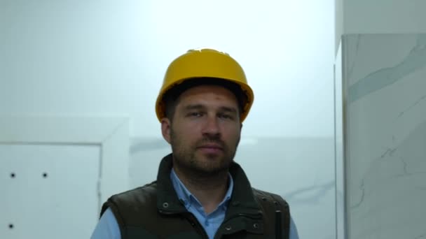 Close Handsome Young Man Builder Yellow Helmet Walking Indoors Building — Stock video