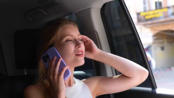 Beautiful Young Joyful Caucasian Business Woman Sitting Car Speaking Mobile — Video