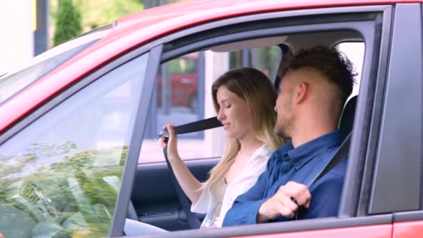 Camera Approaching Young Male Female Couple Sitting Vehicle Fastening Seat — Stock video