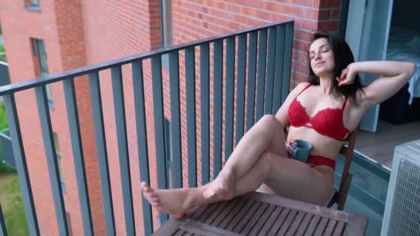 Joyful Attractive Sexy Woman Red Lingerie Resting Home Balcony Sitting — Stok video