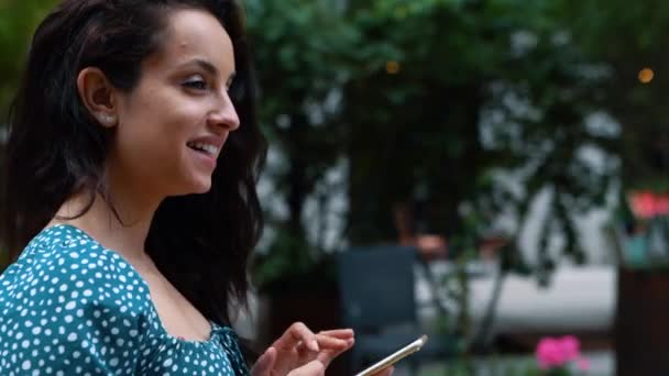 Close Young Caucasian Beautiful Woman Tapping Smartphone Smiling While Walking — Video Stock