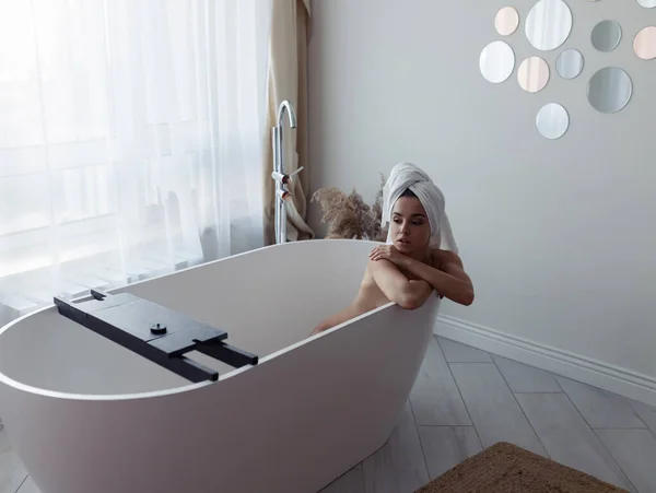Young Beautiful Woman Sitting Modern Empty Bathtub Towel Head Own — Stock Photo, Image