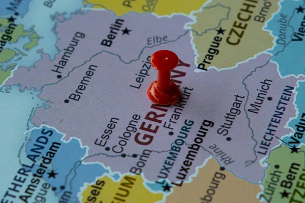 Germany location on map with red thumbtack, travel idea, Berlin and Germany on map with a red fastener, vacation and road trip concept, pinned destination, top view