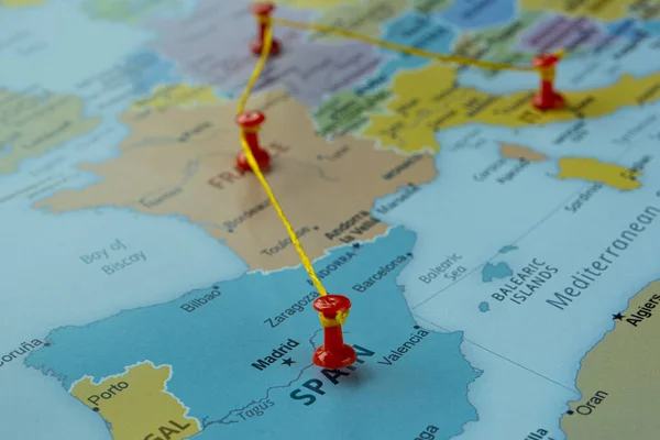 Spain Germany Italy and France on map with red fastener, Europe travel route on map with red thumbtack, travel idea, vacation and road trip concept, Europe destination, top view, selective focus