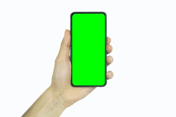 携帯電話のフロントビュー 携帯電話の空の画面を表示し コピースペース 緑の画面 広告コンセプト プロモーションやバナーのためのスマートフォンで携帯電話を保持手 — ストック写真