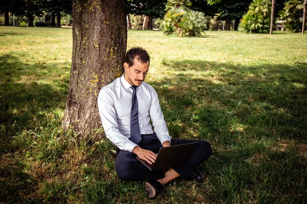 Beautiful Businessman Working Park Young Businessman Sitting Lawn While Uses Imagen de stock